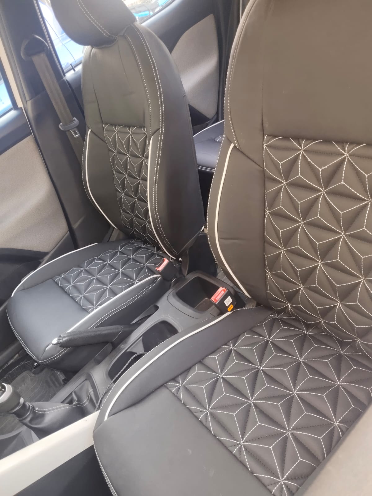 Black geometric stitch seat covers installed
